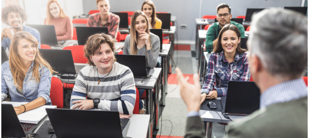 an image of instructor teaching students business simulations